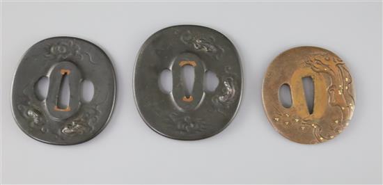 A set of Japanese daisho tsuba and a bronze and mixed metal tsuba, 19th century, 7cm (3)